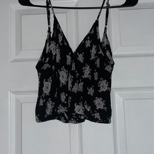 Black top with floral print